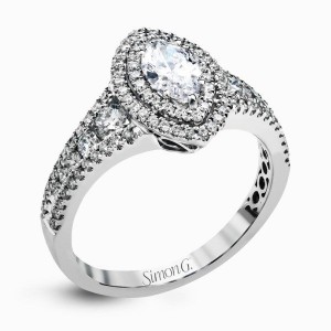 White 18 Karat Engagement Ring Size 6.5 With One 0.28ct Marquise G VS2 Diamond And 0.69tw Round Diamonds  Serial #: 587373