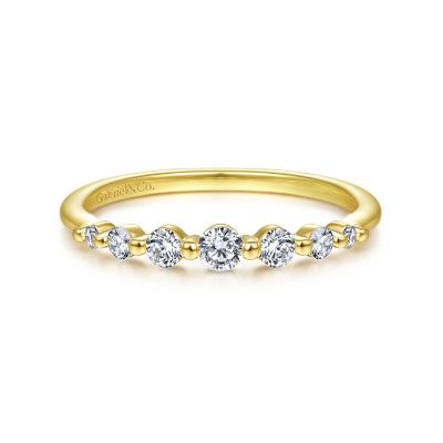 Gabriel & Co 14 Karat Yellow Gold Graduating Single Prong Stackable Band With 7 Round Diamonds At 0.27 Total Diamond Weight