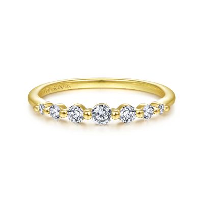 Gabriel & Co 14 Karat Yellow Gold Graduating Single Prong Stackable Band With 7 Round Diamonds At 0.27 Total Diamond Weight