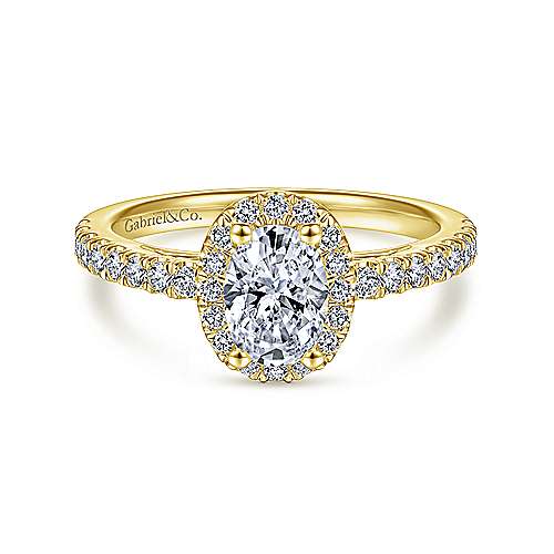 Gabriel & Co:14 Karat Yellow Gold Oval Halo Semi-Mount Ring With 30 Round G/H SI1-2 Diamonds At 0.44 Total Diamond Weight 
*Setting only, center stone not included