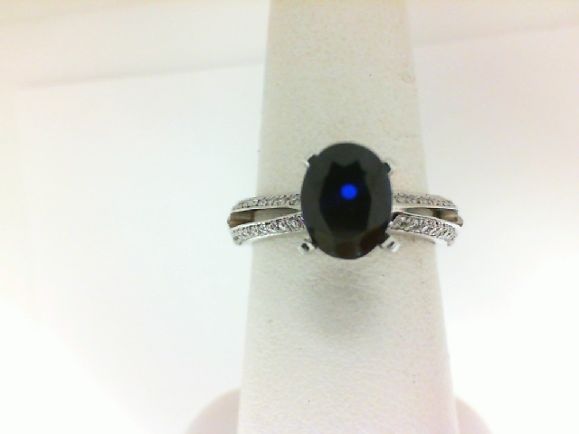 14 Karat White Gold Ring With 0.25Tw Round Diamonds And One 1.91Ct Oval Sapphire