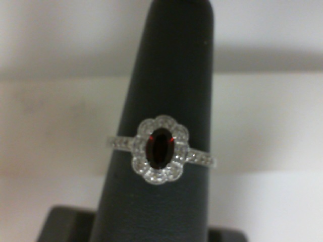 White Gold 10 Karat Fashion Ring With One 6.00X4.00Mm Oval Garnet And 0.15Tw Round Diamonds
