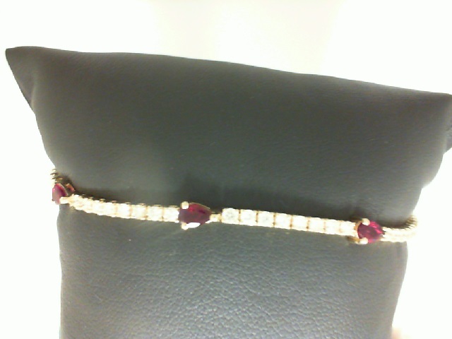 14 Karat Yellow Gold Bracelet With 3=0.78Tw Pear Rubies And 28=0.75Tw Round Diamonds
Length: 7.25