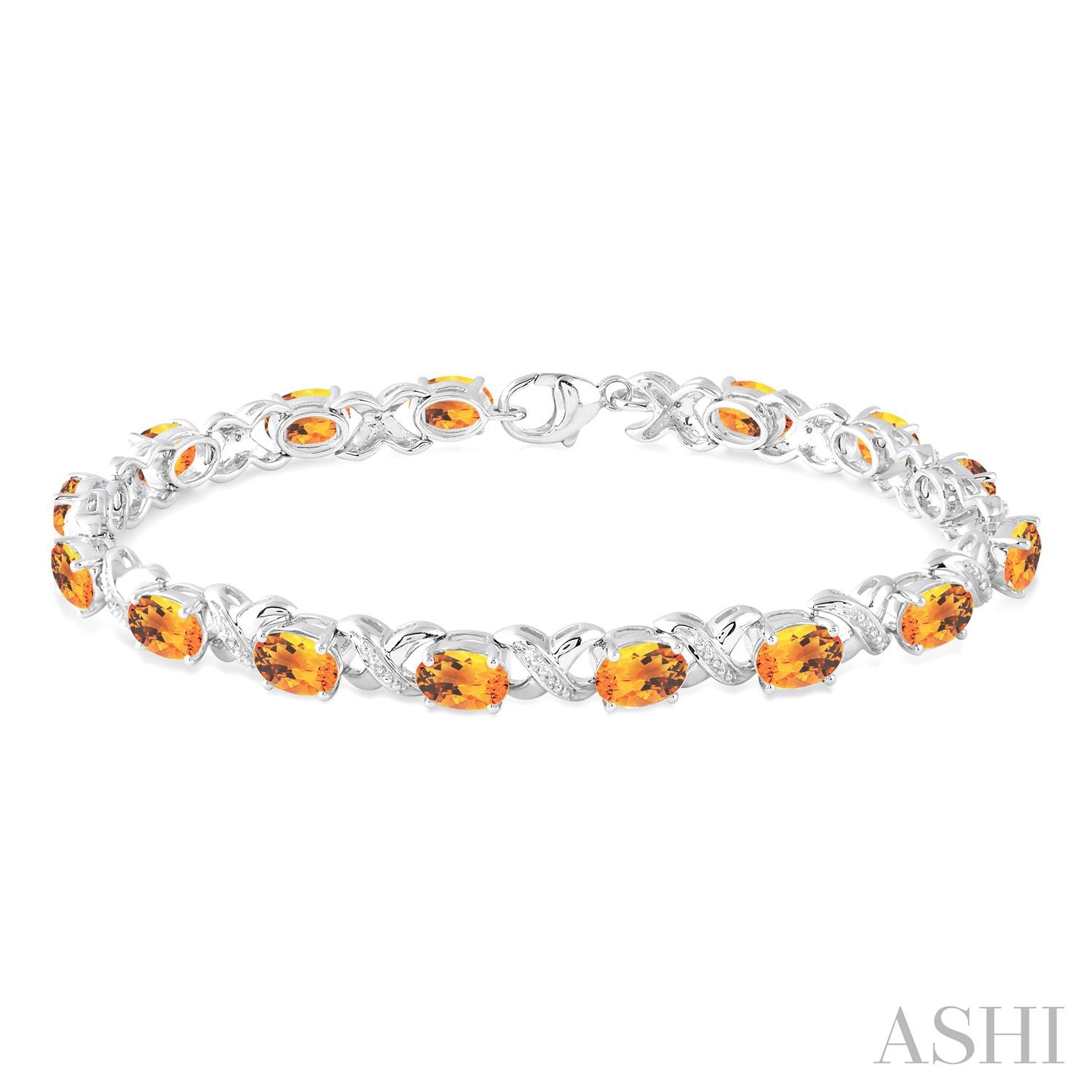 Sterling Silver Bracelet With 15=7.00X5.00mm Oval Citrines And 0.05Tw Round Diamonds
