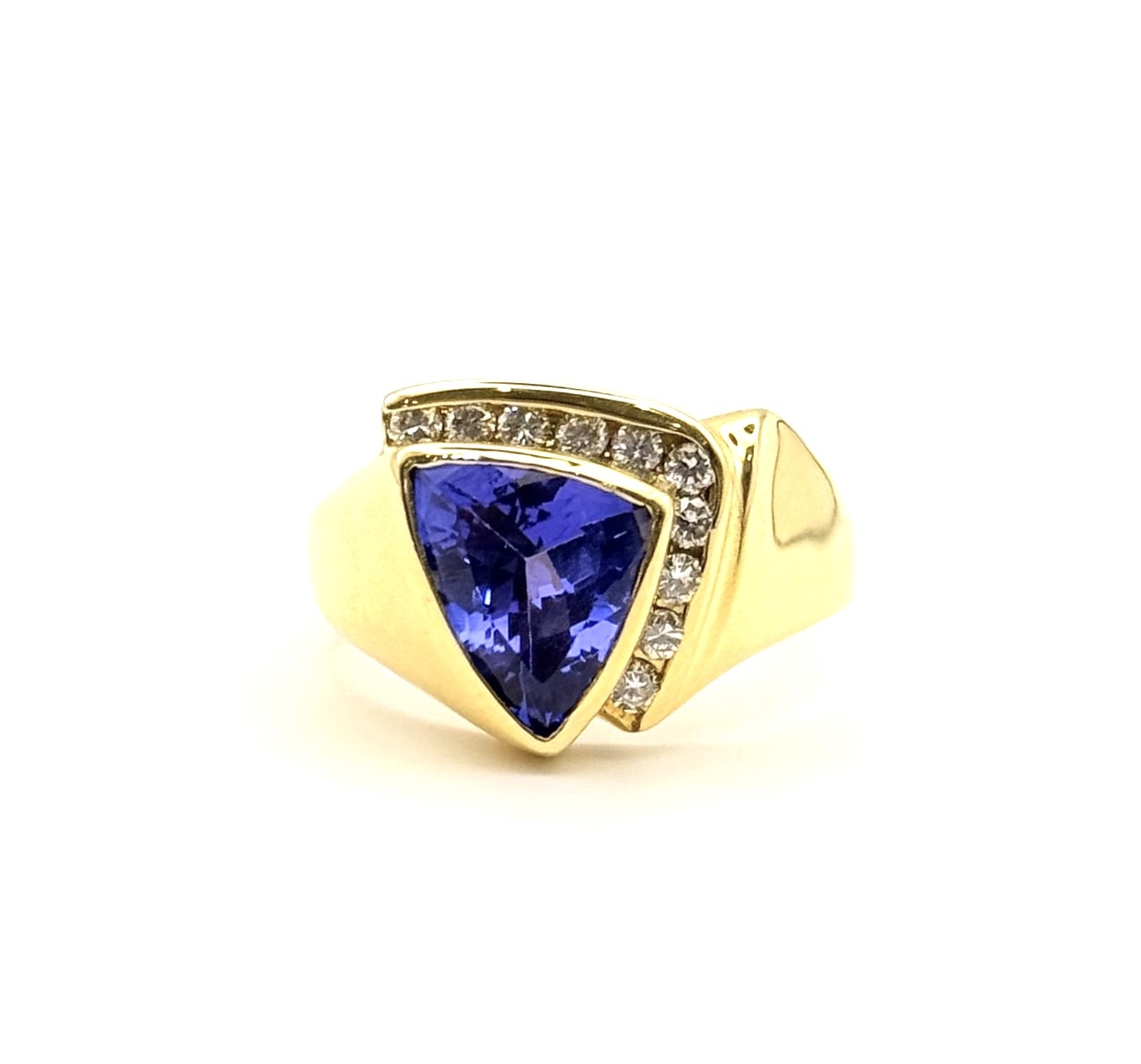 18 Karat Yellow Gold Estate Tanzanite & Channel Set Diamond Ring 
Size 8
Tanzanite:  8.43 x 11.17 x 4.94 mm 
Very Good Condition
